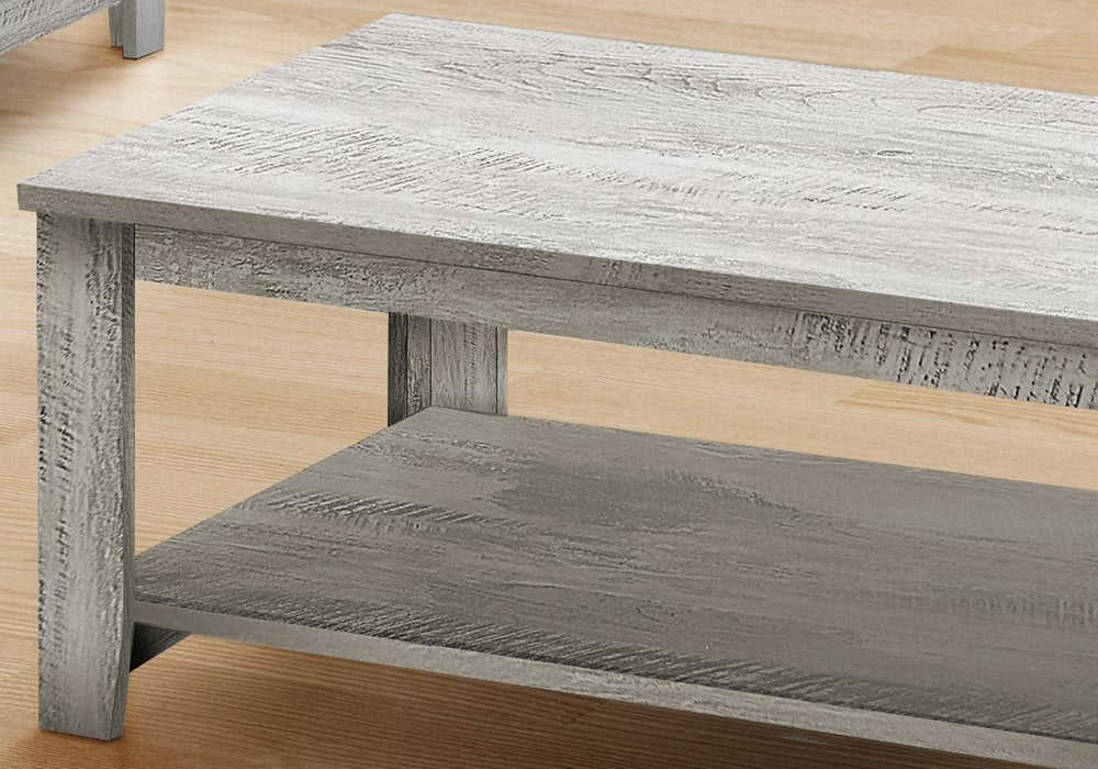 Set Of Three 42" Gray Rectangular Coffee Table With Three Shelves in a home interior