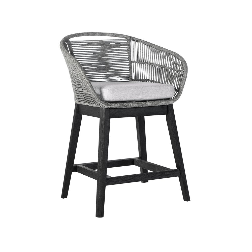 Gray woven outdoor bar stool with a light gray cushion and dark wood base on a white background.