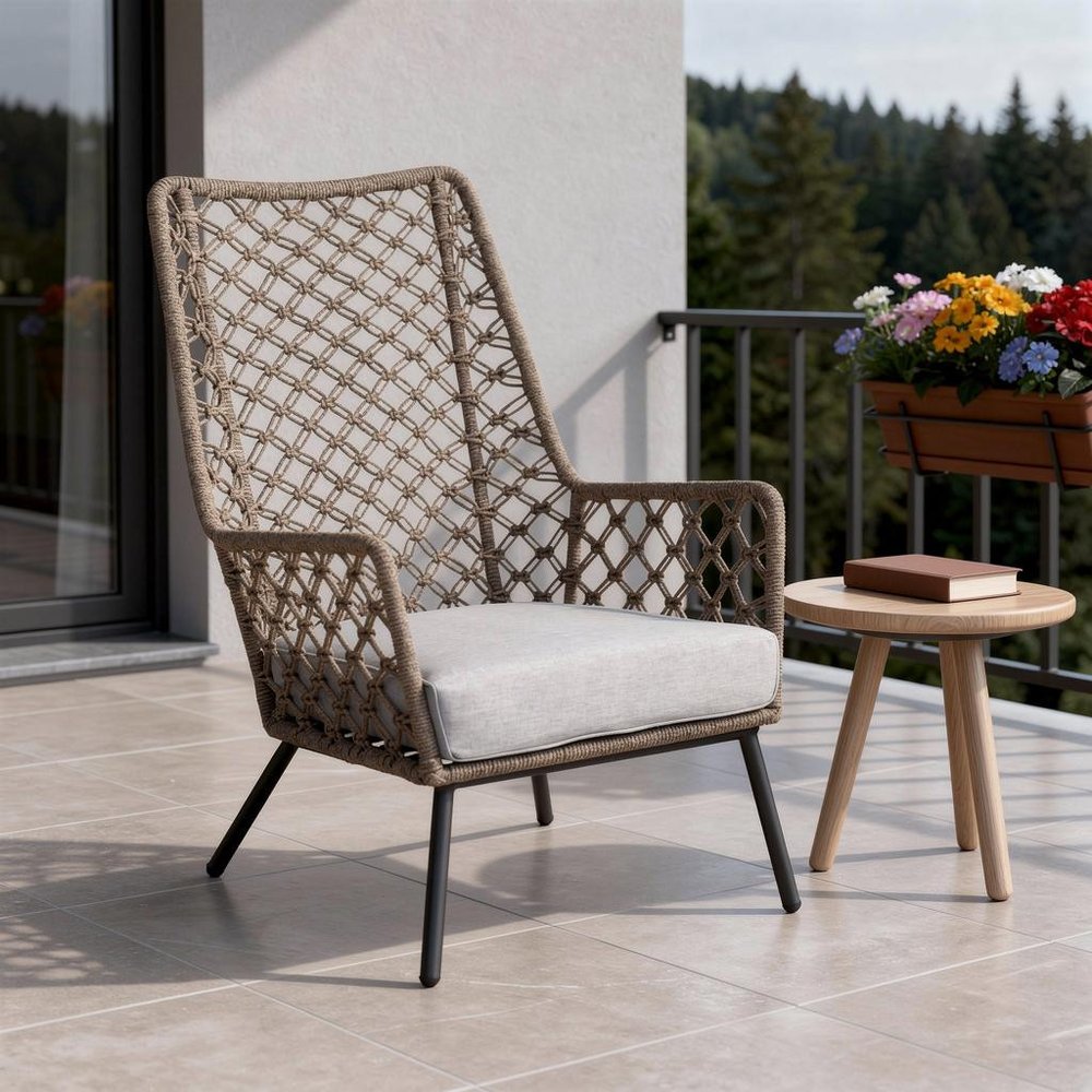 26" Gray Metal Outdoor Arm Chair with Gray Cushion styled in a furnished interior with a light gray wall on a tiled floor in taupe metal.