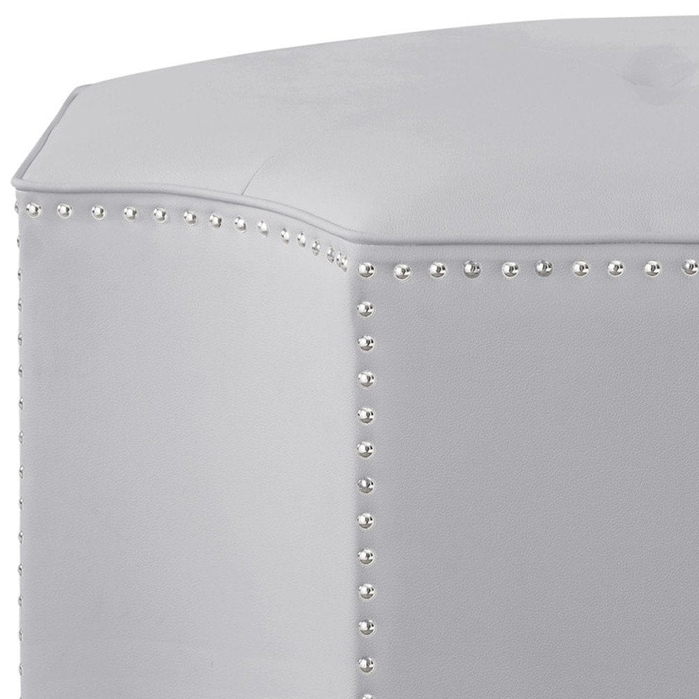 Close-up of 33" Silver Faux Leather Tufted Octagonal Cocktail Ottoman showing the silver faux leather texture.