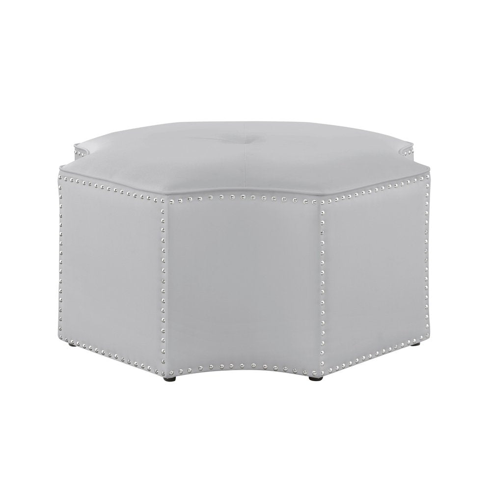 33" Silver Faux Leather Tufted Octagonal Cocktail Ottoman. Ottoman isolated on a plain white background, finished in silver faux leather.