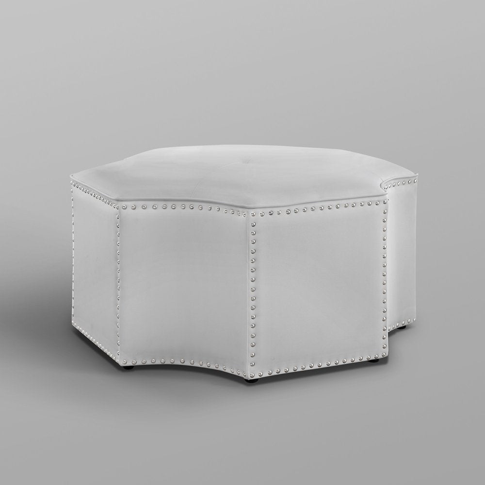 33" Silver Faux Leather Tufted Octagonal Cocktail Ottoman. Ottoman isolated on a plain white background, finished in silver faux leather.
