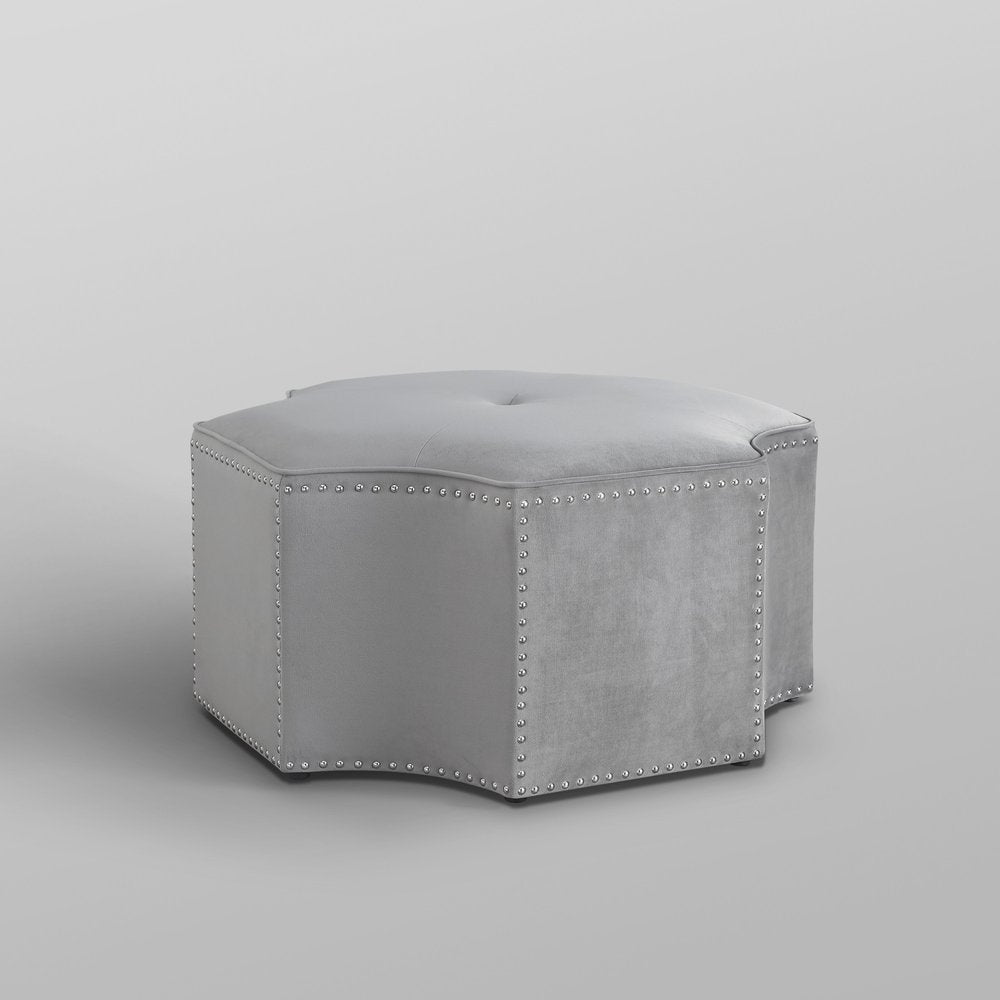 33" Silver Faux Leather Tufted Octagonal Cocktail Ottoman. Ottoman isolated on a plain white background, in a silver faux leather finish.