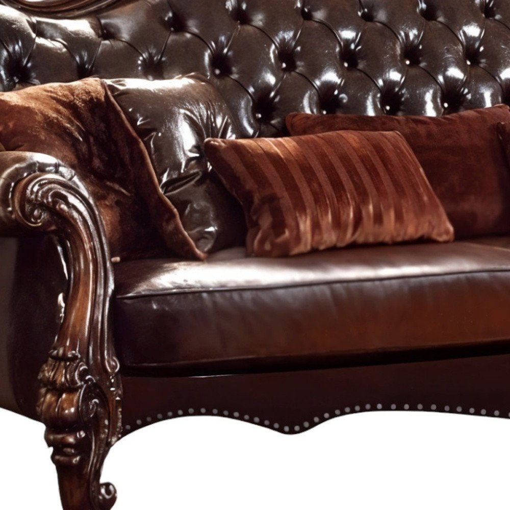 93" Brown Faux Leather Sofa And Toss Pillows With Burgundy Legs close-up detail