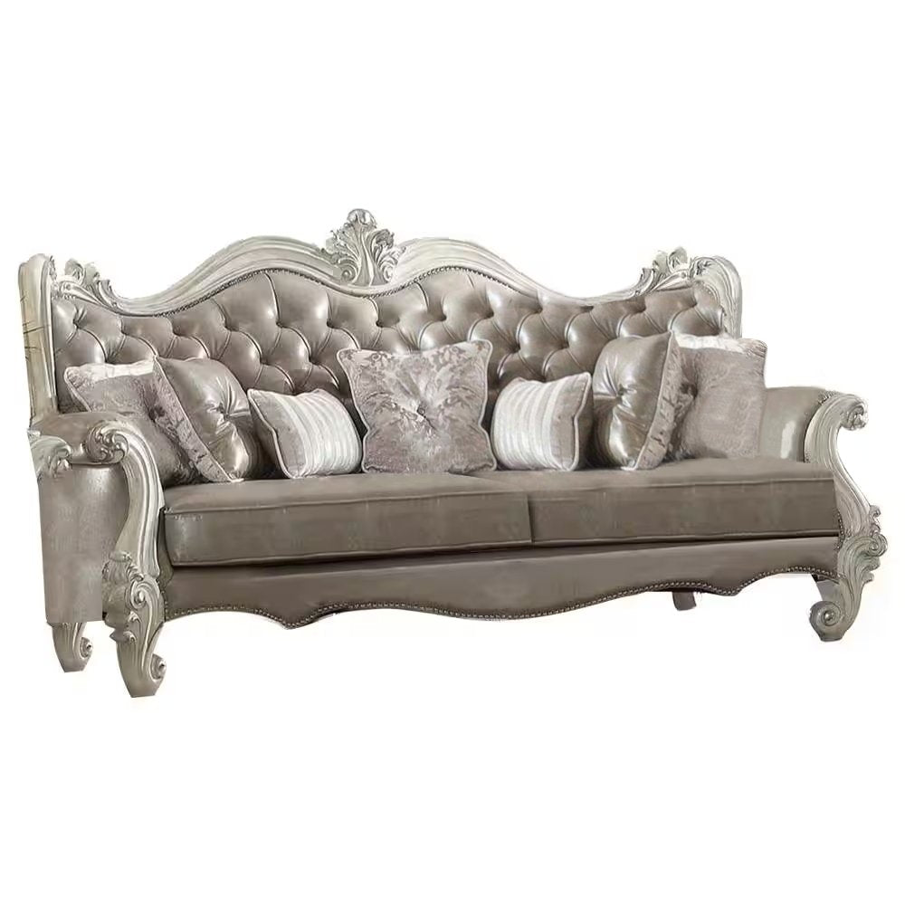 90" Gray Faux Leather Curved Sofa And Toss Pillows With Bone Legs on a white background