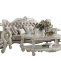 90" Gray Faux Leather Curved Sofa And Toss Pillows With Bone Legs on a white background