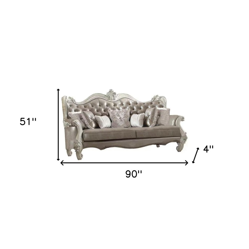 90" Gray Faux Leather Curved Sofa And Toss Pillows With Bone Legs on a white background