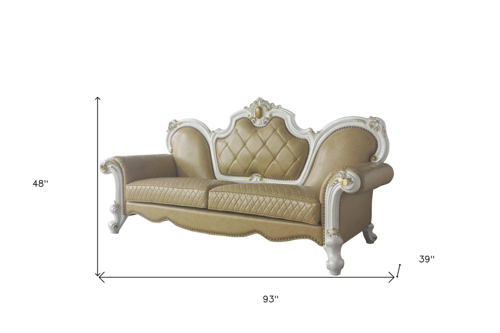 93" Golden Brown Faux Leather Sofa And Toss Pillows With Pearl Legs on a white background