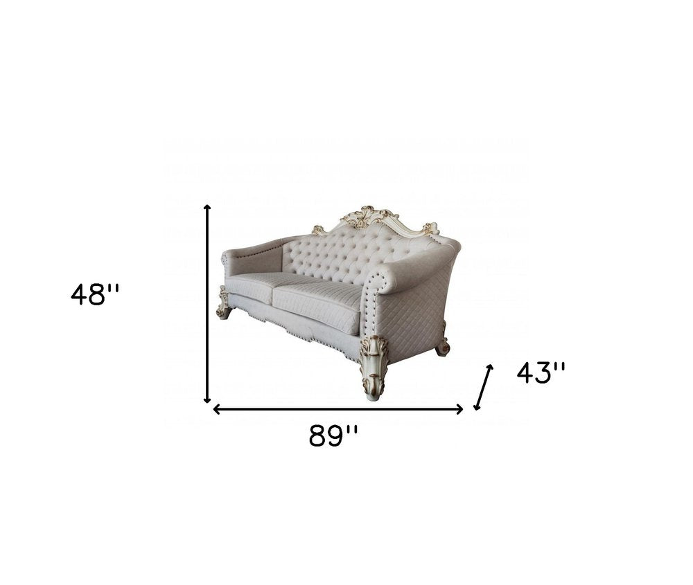 89" Ivory Velvet Sofa And Toss Pillows With Pearl Legs on a white background