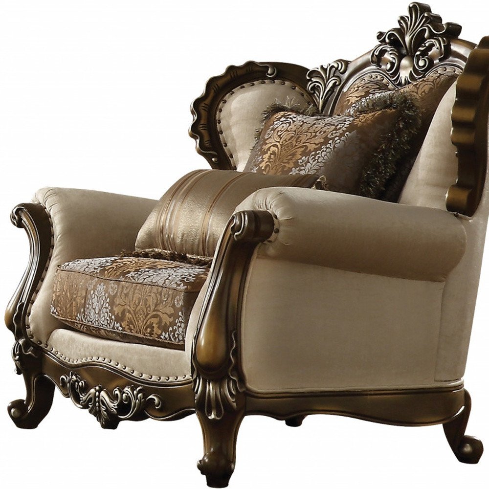 49" Tan and Brown Fabric Damask Tufted Wingback Chair And Toss Pillows. Accent chair isolated on a plain white background, showing a brown fabric surface.