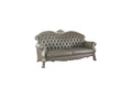 96" Bone Faux Leather Sofa And Toss Pillows With White Legs on a white background
