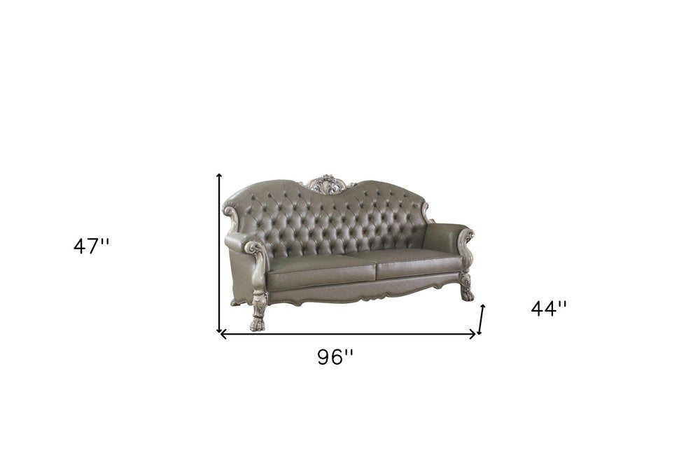96" Bone Faux Leather Sofa And Toss Pillows With White Legs on a white background