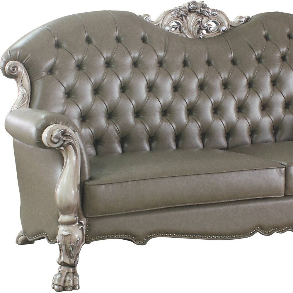 96" Bone Faux Leather Sofa And Toss Pillows With White Legs on a white background
