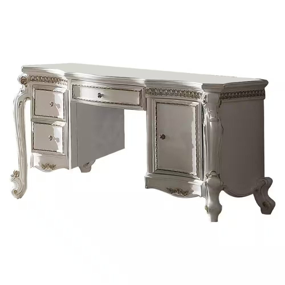 A white ornate wooden vanity table with three drawers and a cabinet, set against a white background.