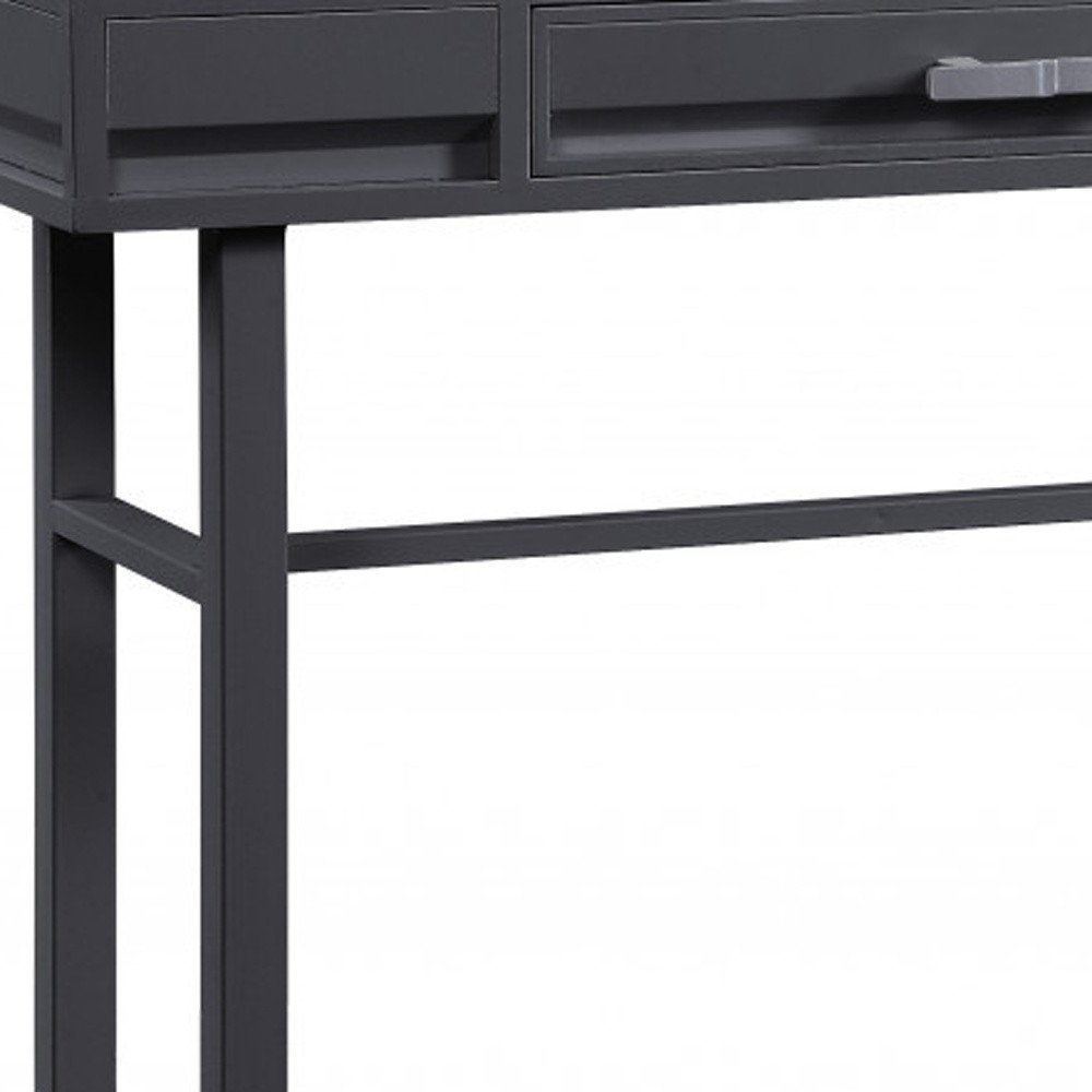 Close-up of a gunmetal iron vanity table with two drawers and a horizontal support bar against a white background.