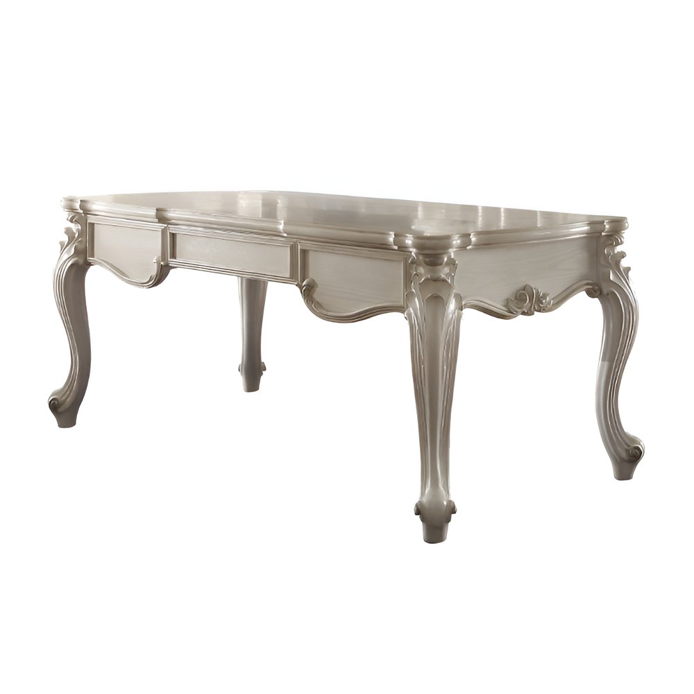 White wood executive desk with three drawers and ornate cabriole legs, isolated on a white background.
