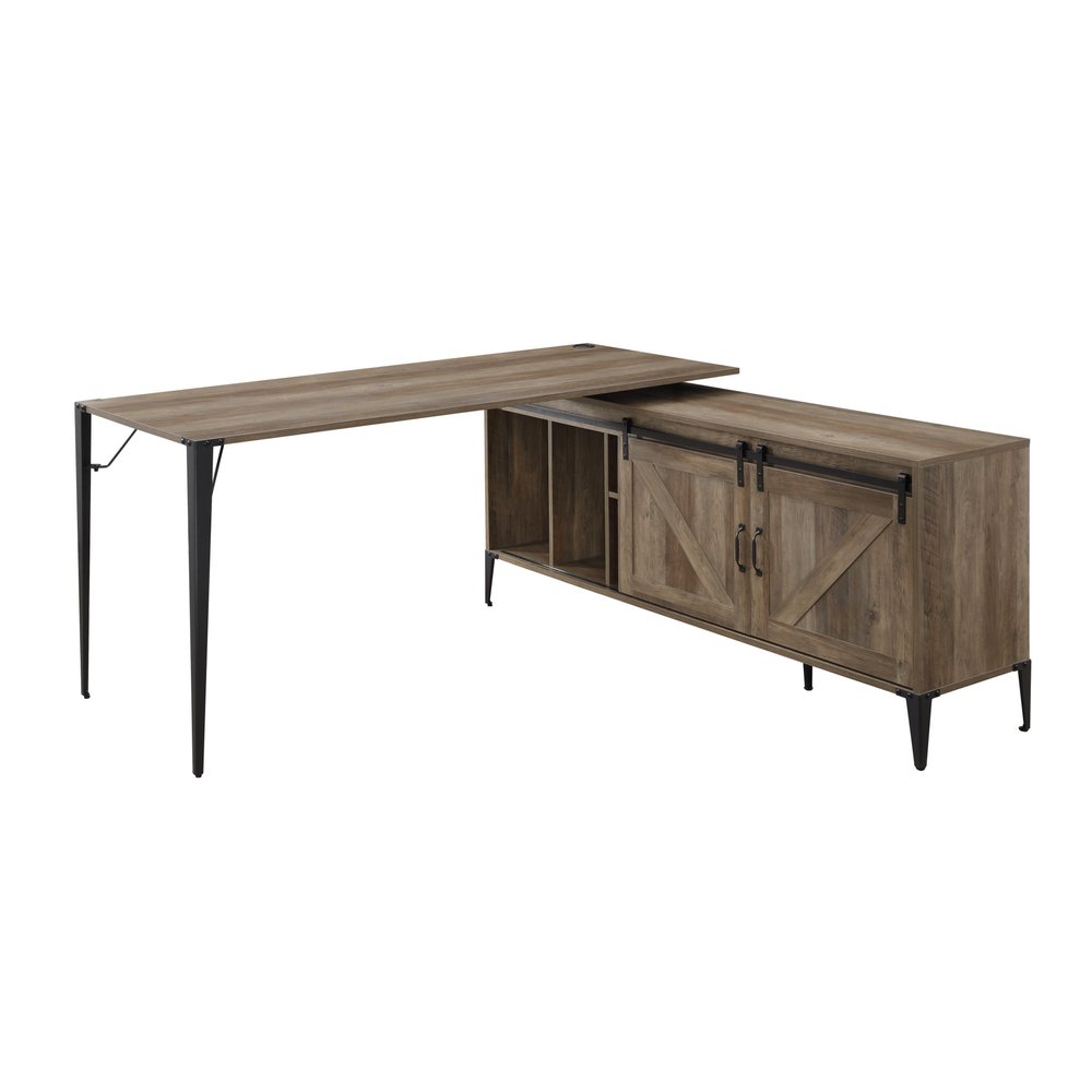 Brown and black L-shaped writing desk with sliding barn doors and open shelving on a white background.