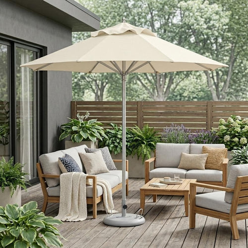 Ecru polyester patio umbrella with stand on a wooden deck with outdoor furniture and plants.
