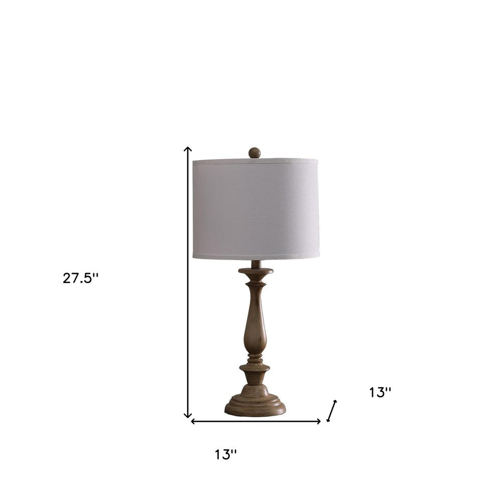 28" Rustic Taupe Cream Candlestick Table Lamp With White Shade. Table lamp isolated on a plain white background, in a cream finish.