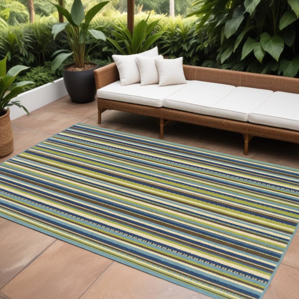 9' X 13' Blue and Green Striped Stain Resistant Indoor Outdoor Area Rug in a home interior