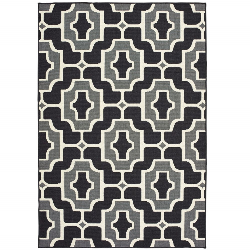 Black and gray geometric indoor outdoor area rug with a stain-resistant finish.