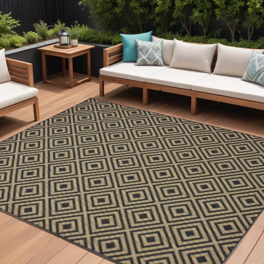 9' X 13' Black and Tan Geometric Stain Resistant Indoor Outdoor Area Rug in a home interior
