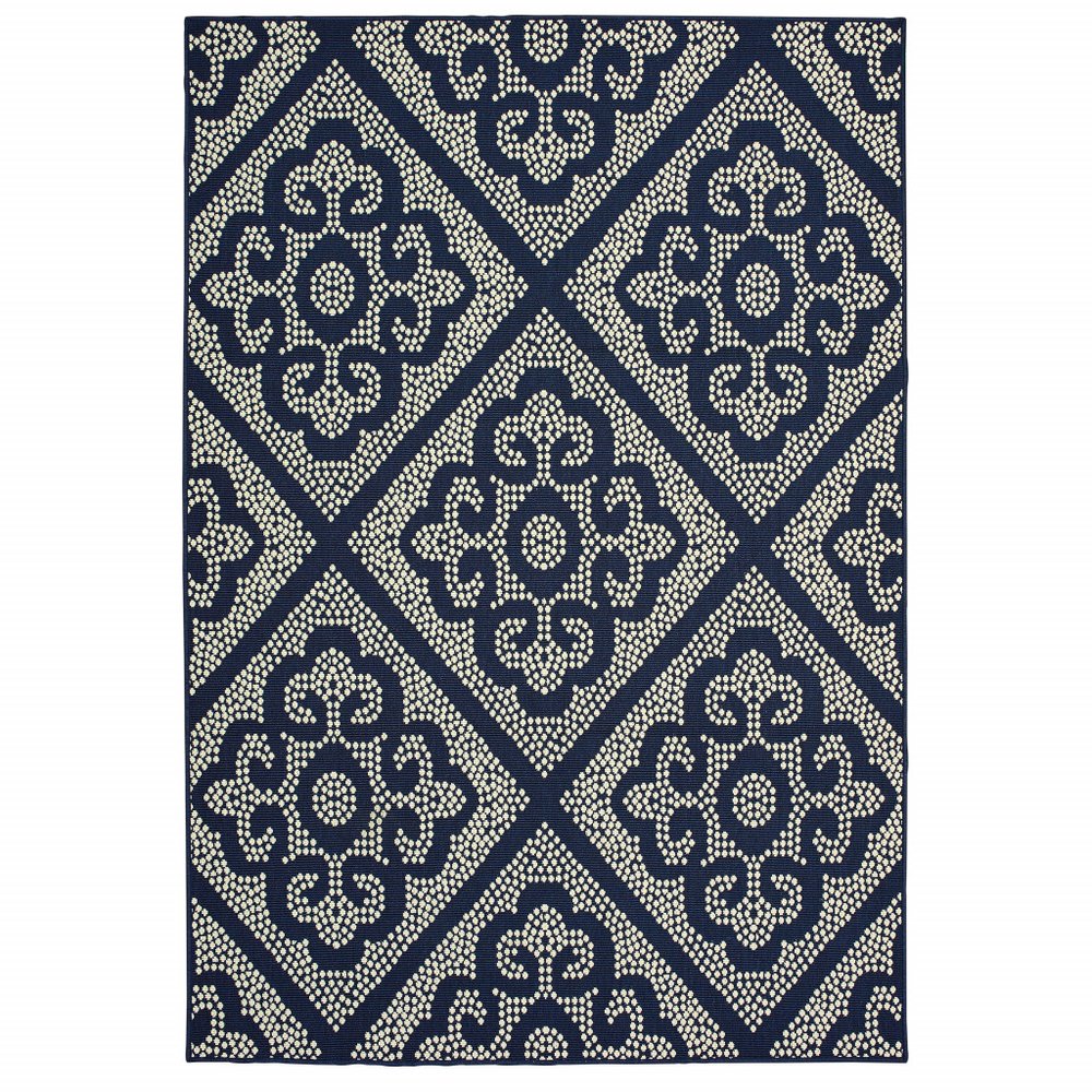Blue and ivory geometric patterned indoor/outdoor area rug with a diamond motif.