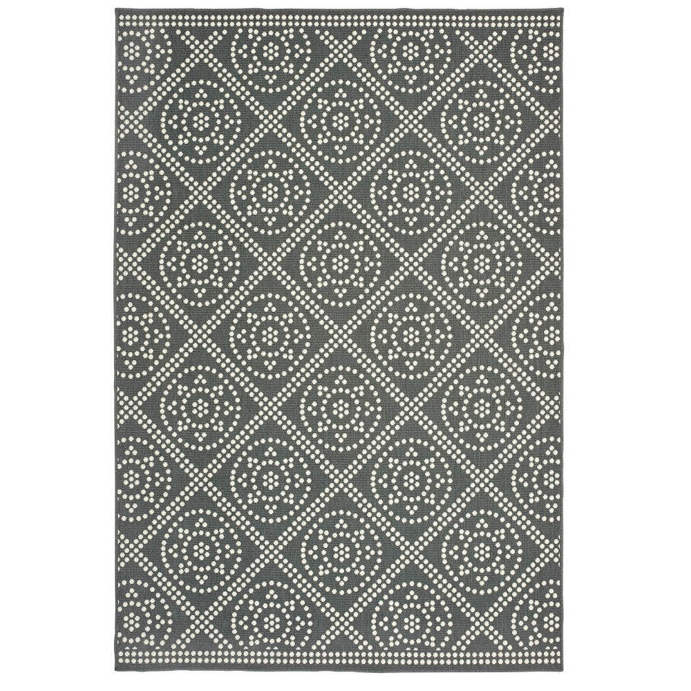 Gray and ivory geometric indoor outdoor area rug with a dotted pattern on a white background.