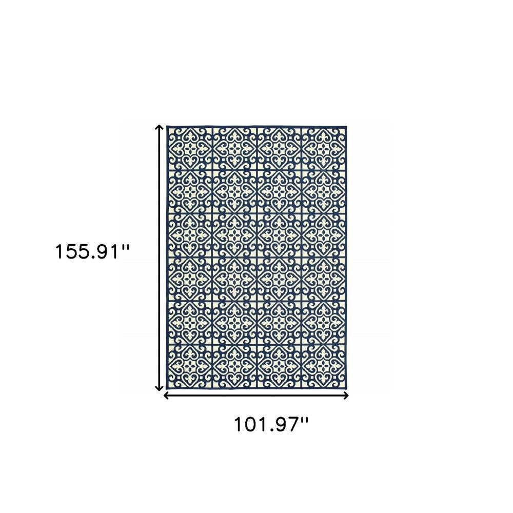 9' X 13' Ivory and Blue Geometric Stain Resistant Indoor Outdoor Area Rug on a white background