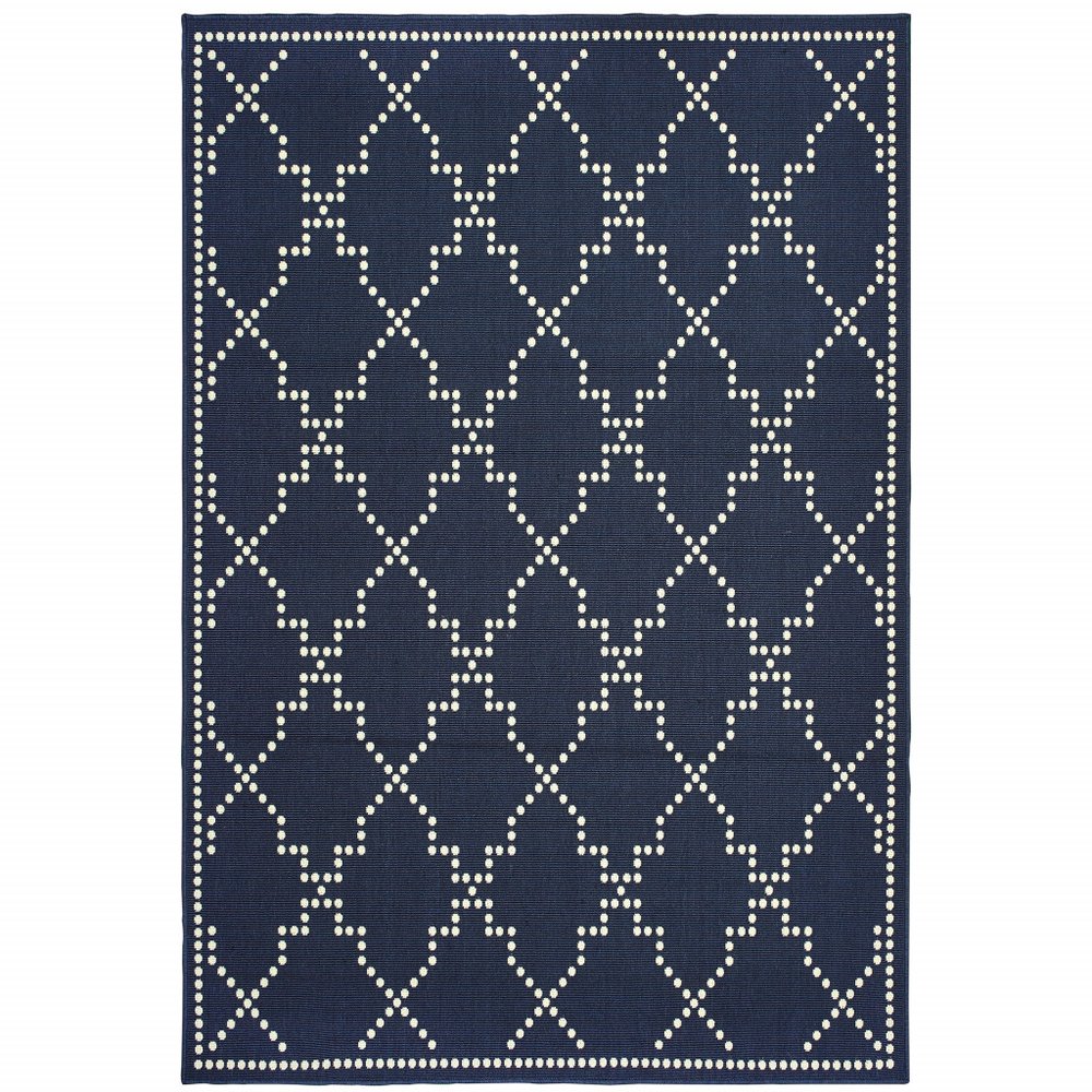 Navy blue and ivory geometric pattern indoor outdoor area rug on a white background.
