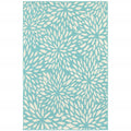 9' X 13' Blue and Ivory Floral Stain Resistant Indoor Outdoor Area Rug on a white background