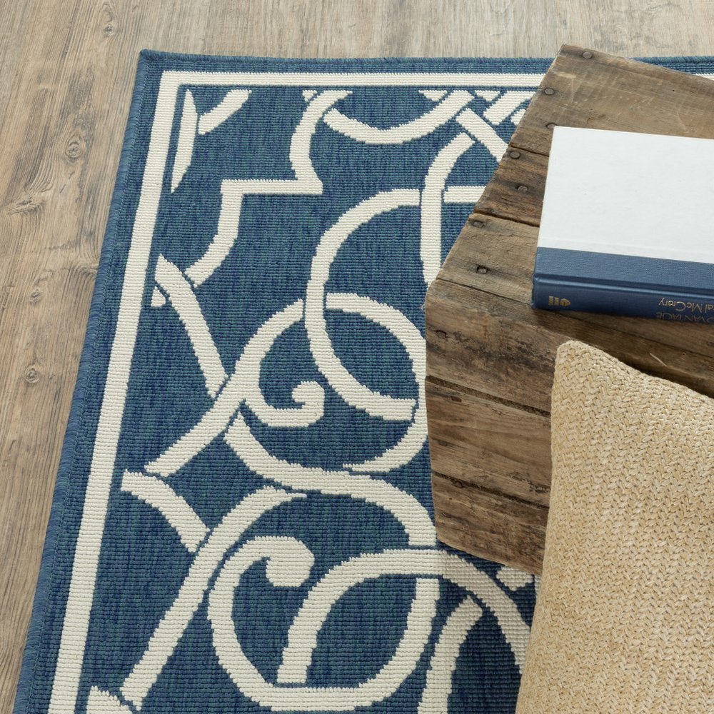 9' X 13' Blue and Ivory Geometric Stain Resistant Indoor Outdoor Area Rug - SKU 507107