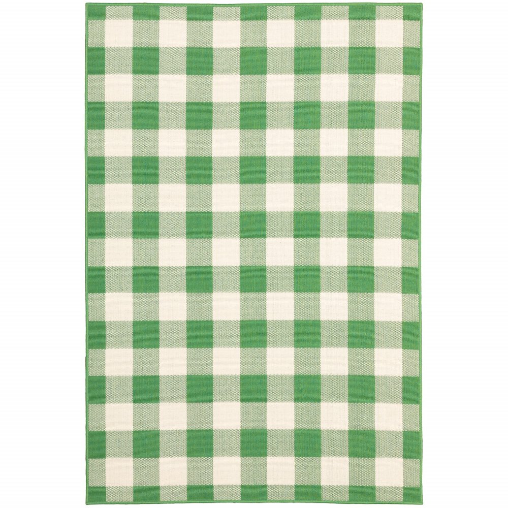A green and ivory buffalo check indoor/outdoor area rug with a geometric pattern on a white background.