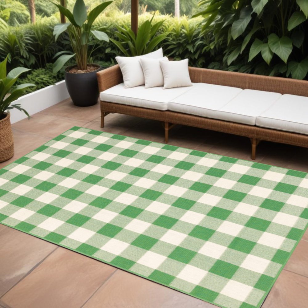 9' X 13' Green and Ivory Geometric Stain Resistant Indoor Outdoor Area Rug in a home interior