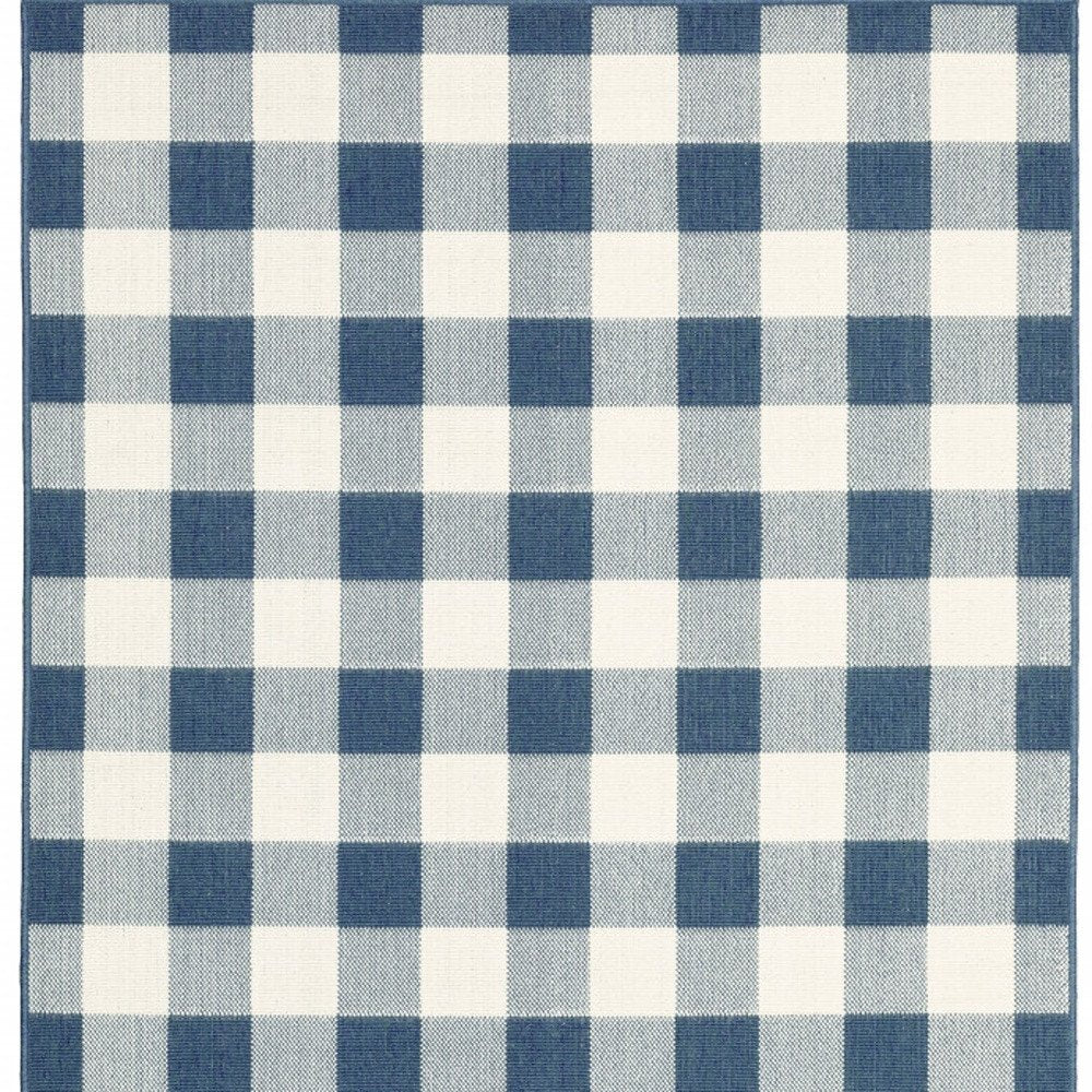 9' X 13' Blue and Ivory Geometric Stain Resistant Indoor Outdoor Area Rug on a white background