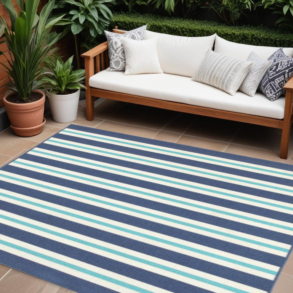 9' X 13' Blue and Ivory Geometric Stain Resistant Indoor Outdoor Area Rug in a home interior
