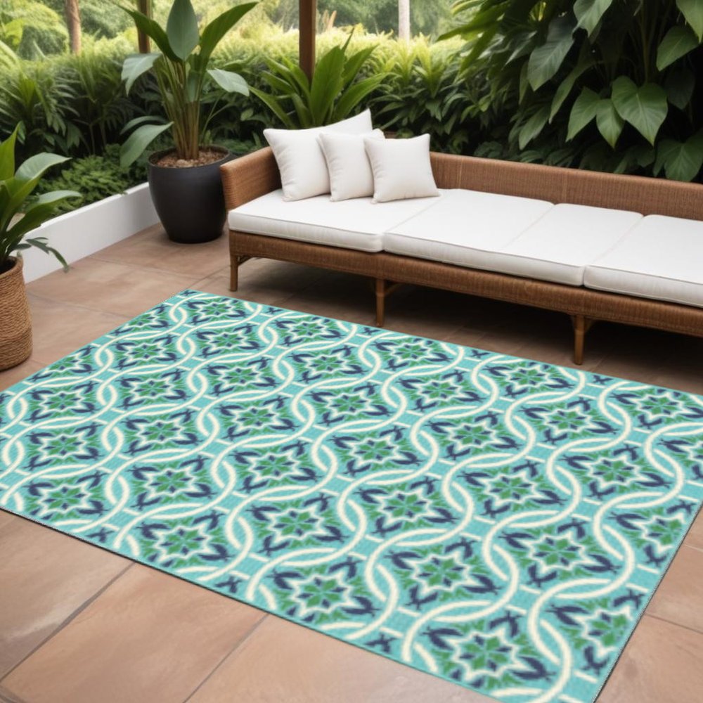 9' X 13' Blue and Green Geometric Stain Resistant Indoor Outdoor Area Rug in a home interior
