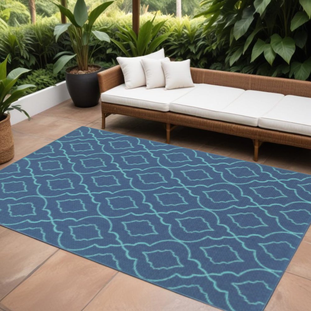 9' X 13' Blue Geometric Stain Resistant Indoor Outdoor Area Rug in a home interior