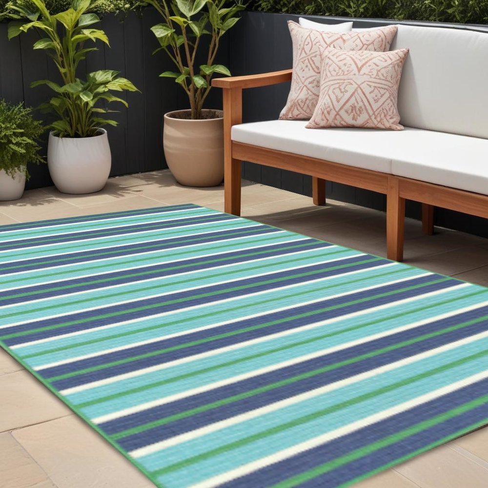 9' X 13' Blue and Green Geometric Stain Resistant Indoor Outdoor Area Rug in a home interior