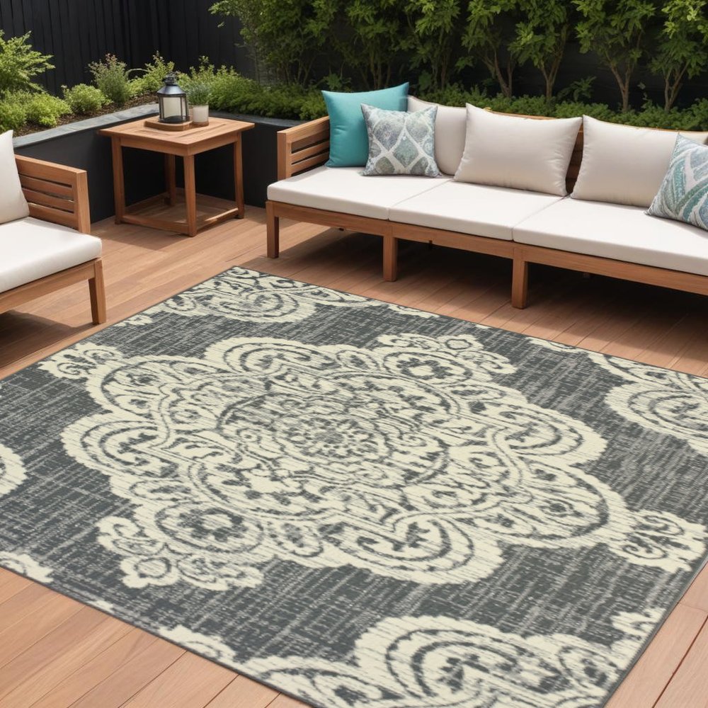 9' X 13' Gray and Ivory Oriental Stain Resistant Indoor Outdoor Area Rug in a home interior