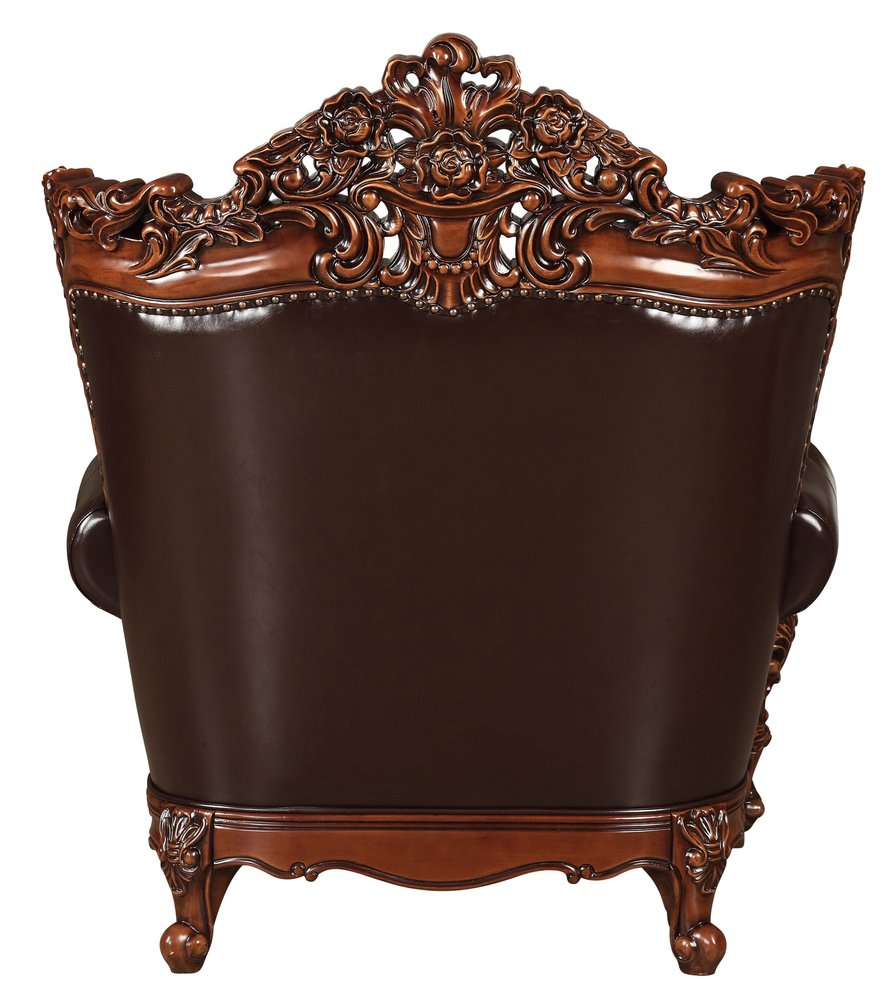 50" Espresso Faux Leather Tufted Wingback Chair And Toss Pillow. Accent chair isolated on a plain white background, in a dark brown faux leather finish.