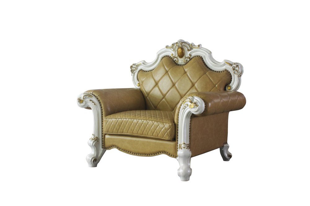 Ornate beige faux leather tufted armchair with white and gold trim on a white background.
