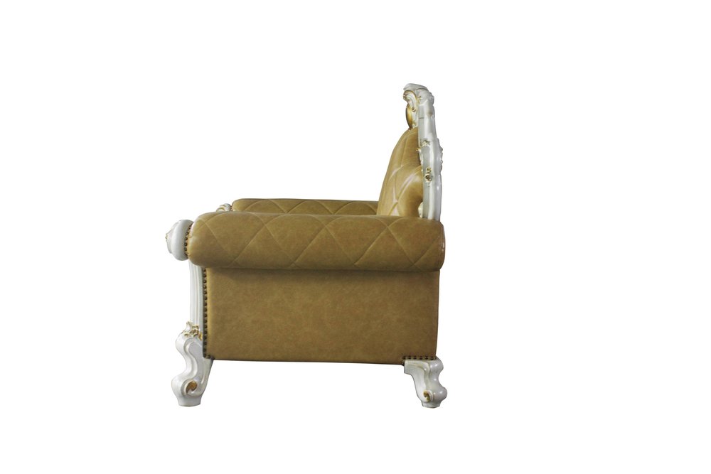 50" Beige and Pearl Faux Leather Tufted Arm Chair And Toss Pillow. Accent chair isolated on a plain white background, finished in beige faux leather.