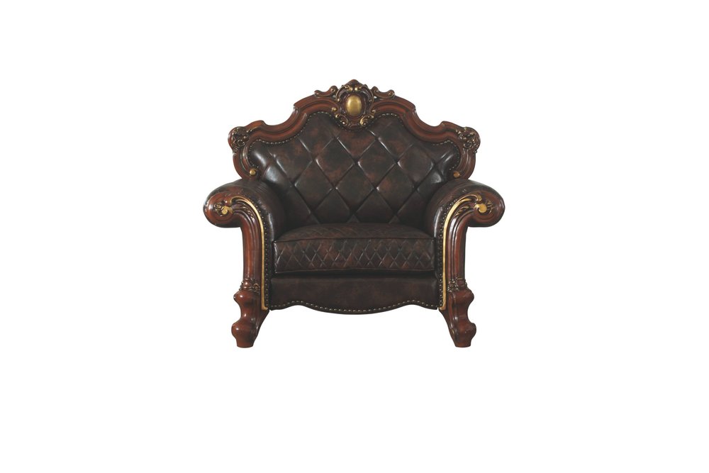 Chocolate faux leather tufted Chesterfield chair with ornate wood trim and gold accents on a white background.