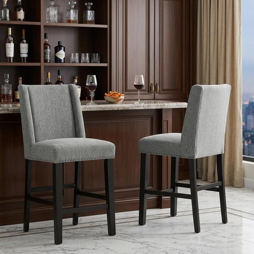 Set of Two 42" Charcoal And Espresso Fabric And Solid Wood Bar Chairs in a home interior