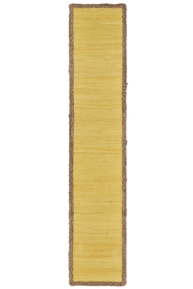 Yellow and natural jute table runner with braided border on a white background