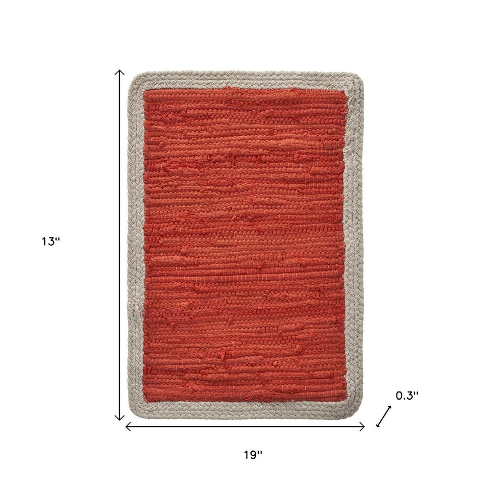 19" Set of Four Orange And Natural Solid With Border Cotton Placemats. Dining linen isolated on a plain white background, in a tan linen finish.