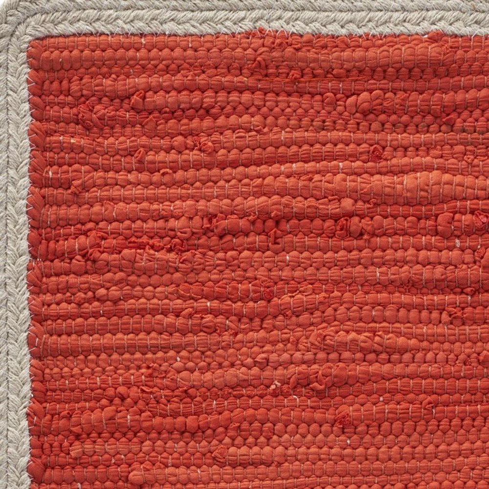19" Set of Four Orange And Natural Solid With Border Cotton Placemats. Dining linen in tan linen.