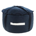 Dark blue polyester round pouf ottoman with a white fabric handle on a white background.