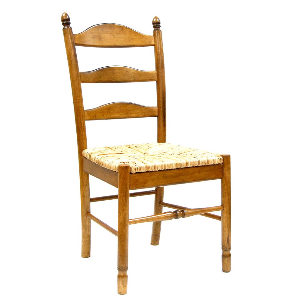 A brown wood ladder back dining chair with a straw seat on a white background.